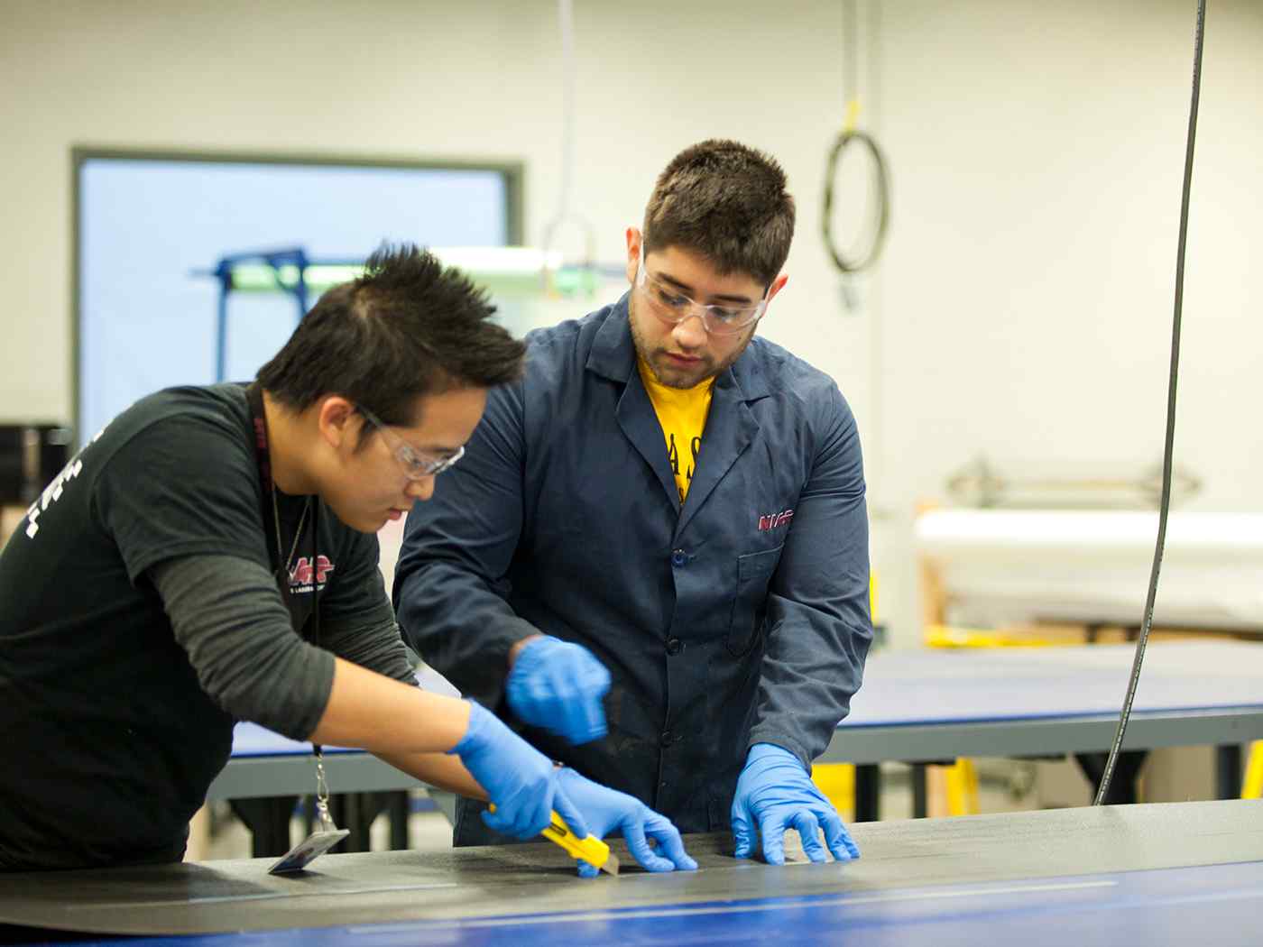 Graduate Engineering students working in NIAR lab.