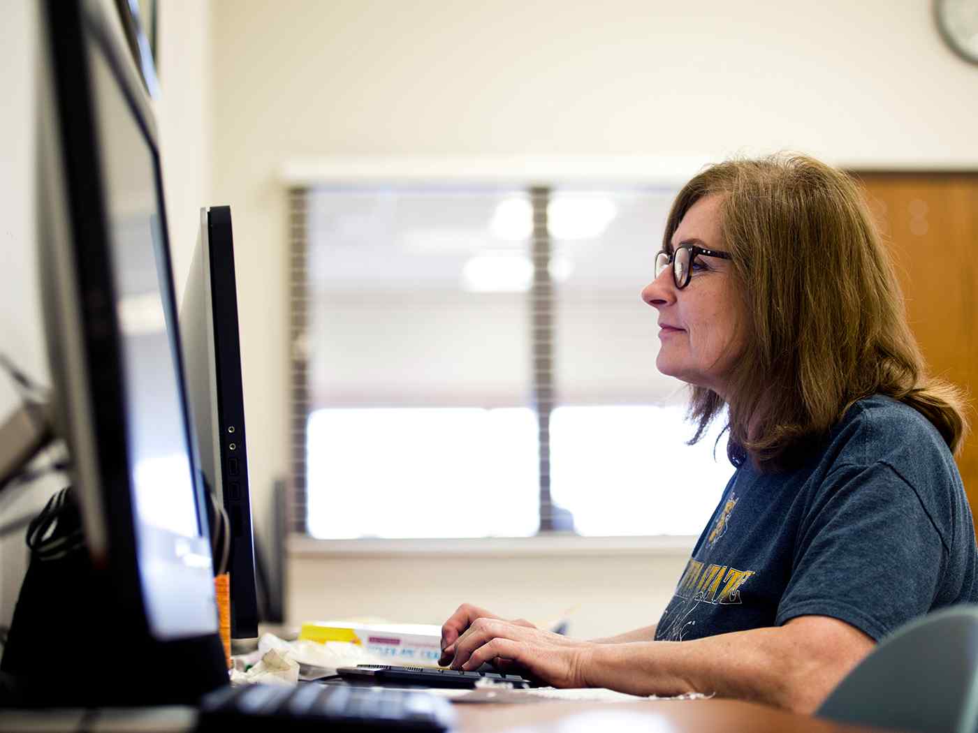 Adult learner completing computer work